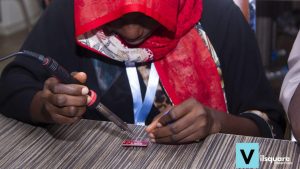 Woman soldering